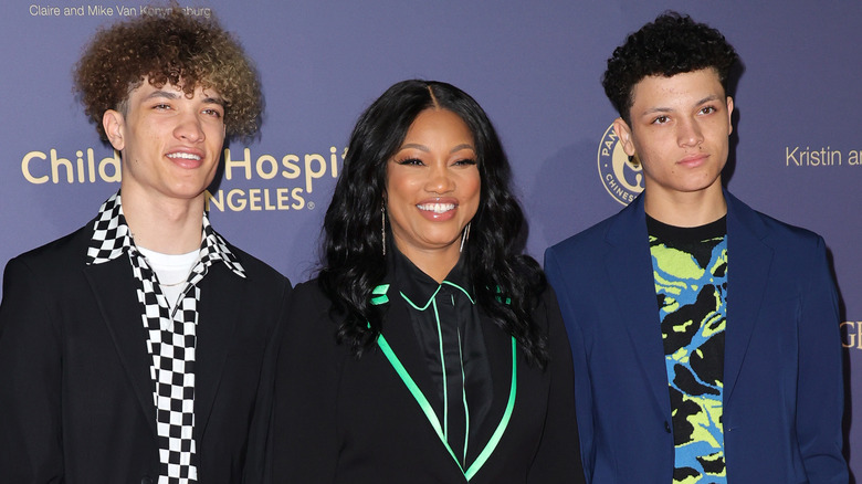 Garcelle Beauvais and her twin sons at an event