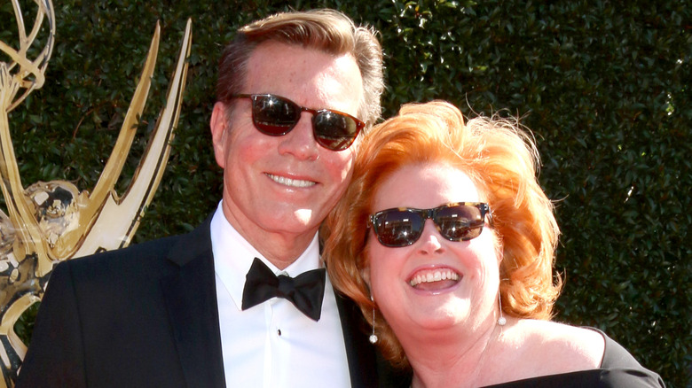 Peter Bergman and Mariellen smiling in sunglasses