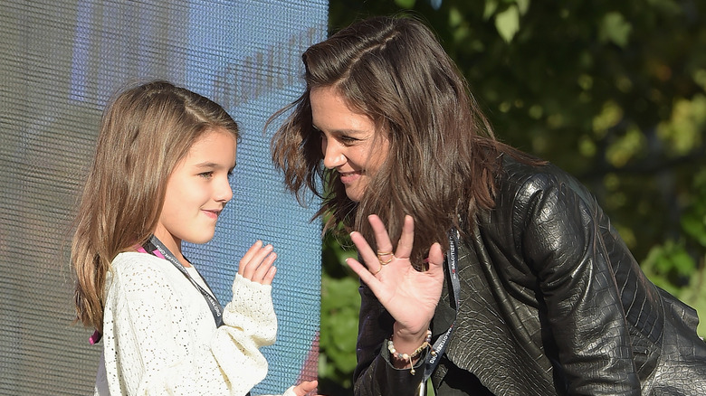 Suri Cruise on stage with Katie Holmes