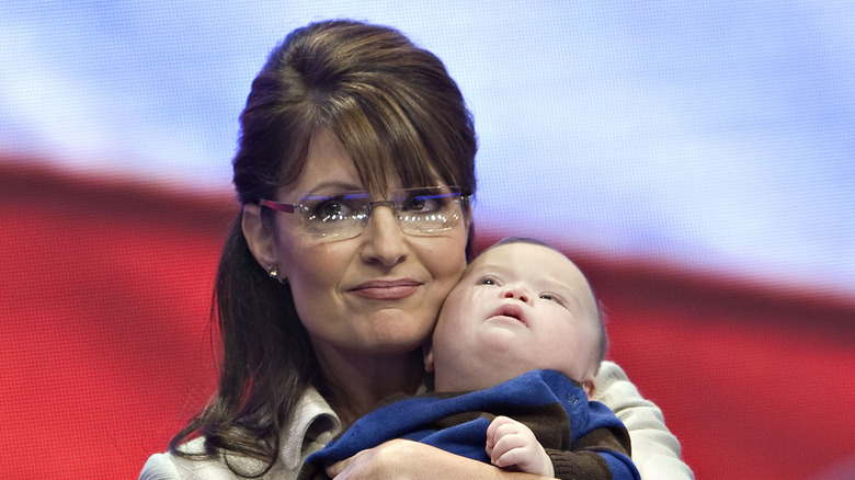 Sarah carrying baby Trig Palin