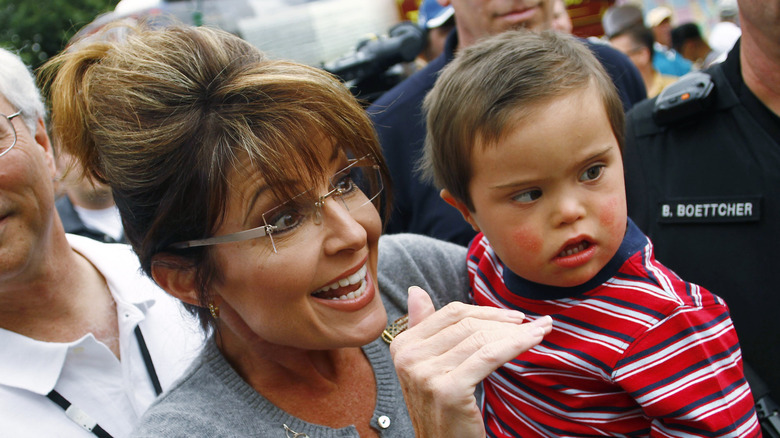 Sarah and toddler Trig Palin in a crowd 