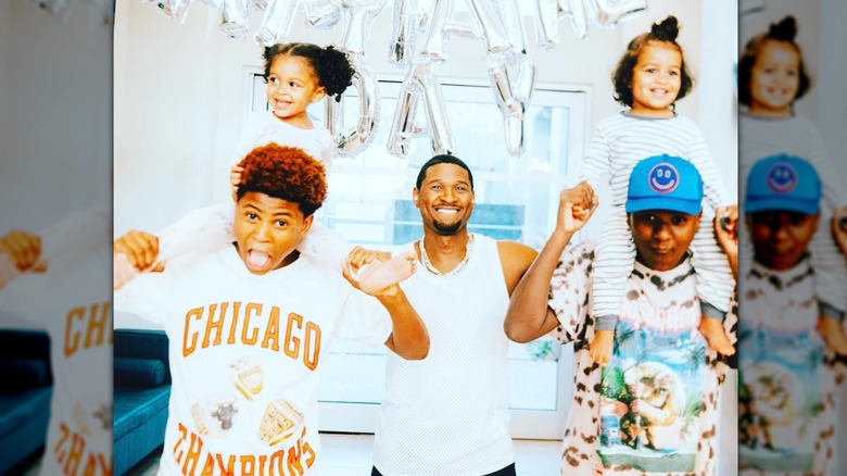 Usher and his four children