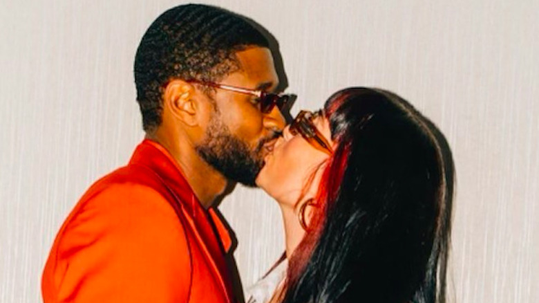 Jenn Goicoechea and Usher kissing 