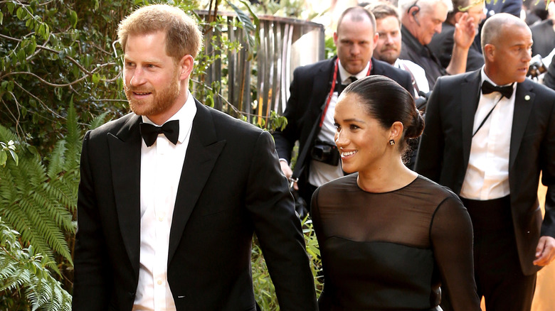 Meghan and Harry holding hands