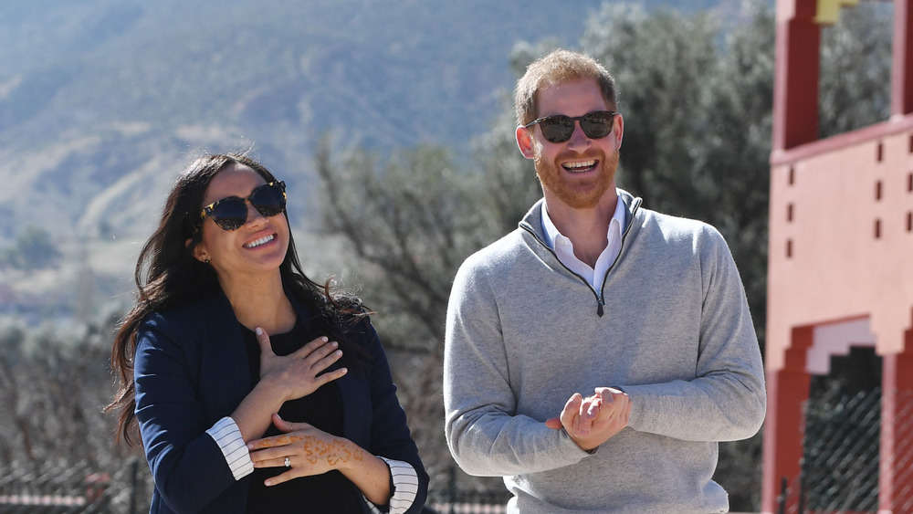 Harry and Meghan laughing in Morocco