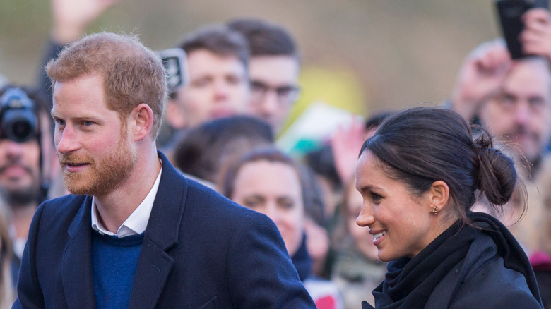 Prince Harry and Meghan Markle smiling