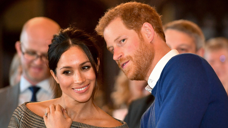 Meghan Markle and Prince Harry conferring