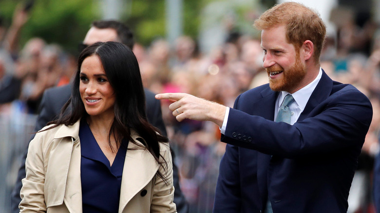 Meghan Markle and Prince Harry greeting fans