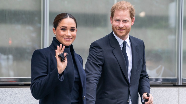 Meghan and Harry holding hands