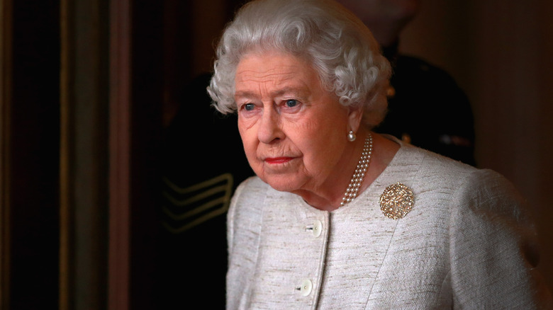 Queen Elizabeth looking despondently into the distance