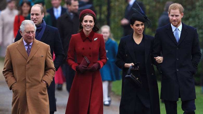 King Charles, the Prince and Princess of Wales, and the Duke and Duchess of Sussex walking