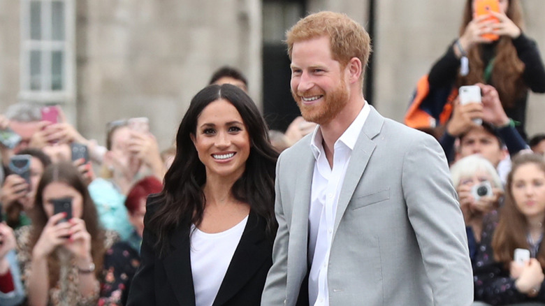 Meghan Markle and Prince Harry smiling during an appearance in Ireland