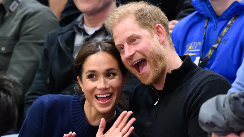 Meghan Markle and Prince Harry pose for a photo