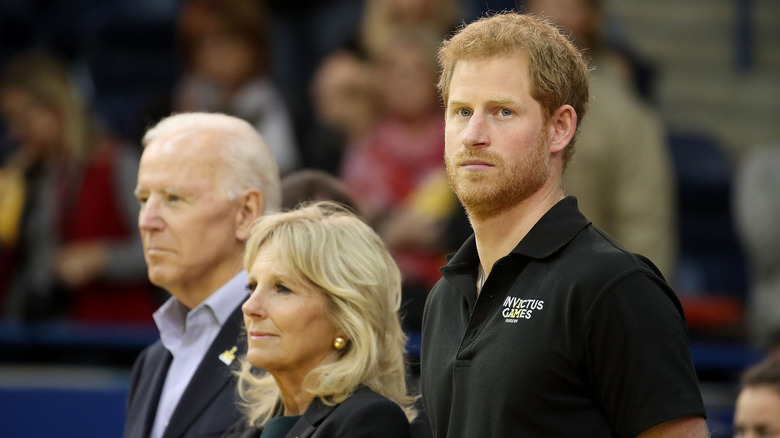 Prince Harry standing with the Bidens