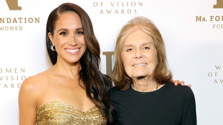 Meghan Markle and Gloria Steinem smiling