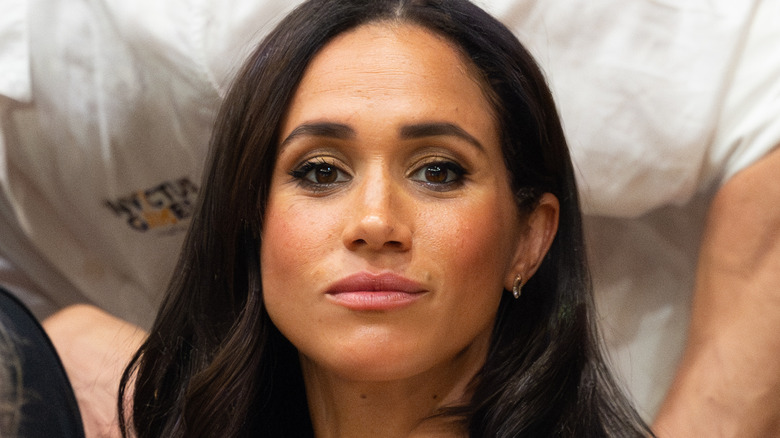 Meghan Markle smirking