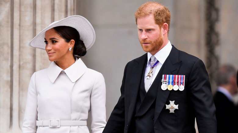 Meghan Markle and Prince Harry holding hands