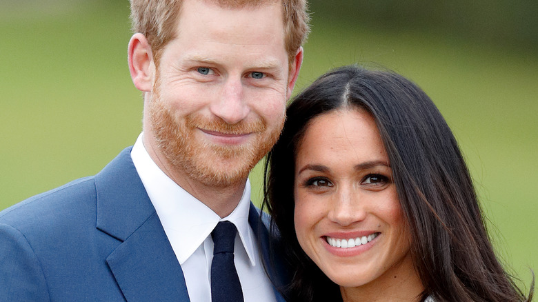 Prince Harry and Meghan Markle smiling