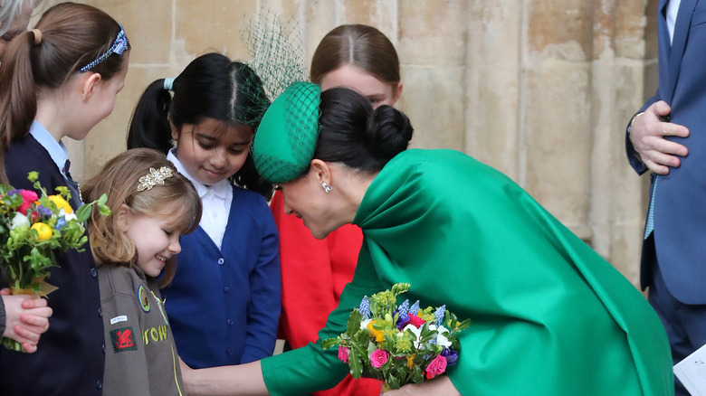 Meghan Markle greets kids