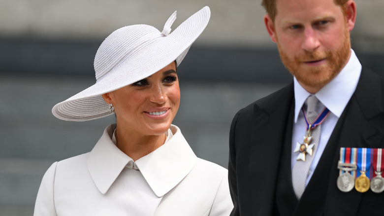 Meghan Markle and Prince Harry smiling at the Platinum Jubilee