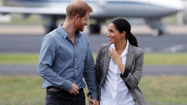 Prince Harry and Meghan Markle walking