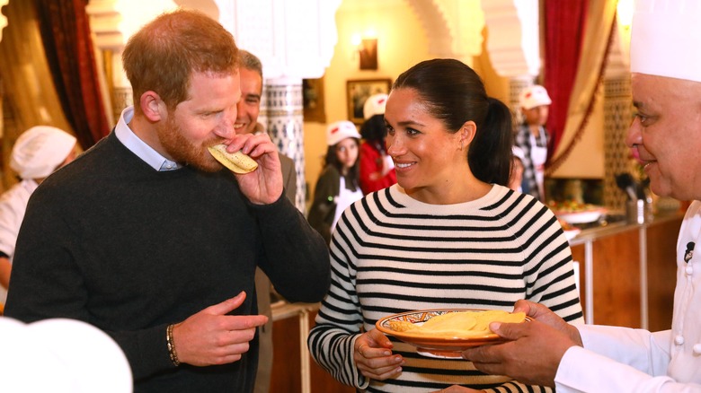 Harry and Meghan eating crepes