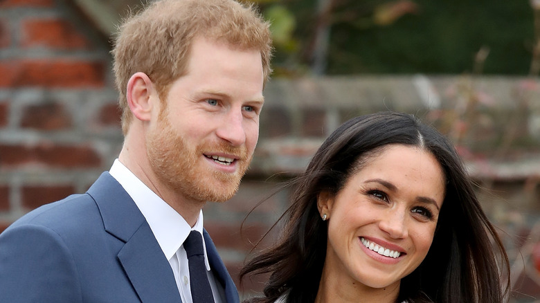 Prince Harry and Meghan Markle smiling