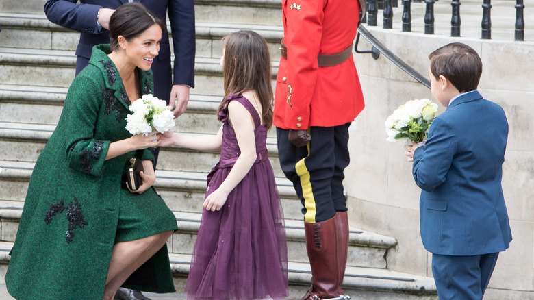 Meghan Markle posing with children