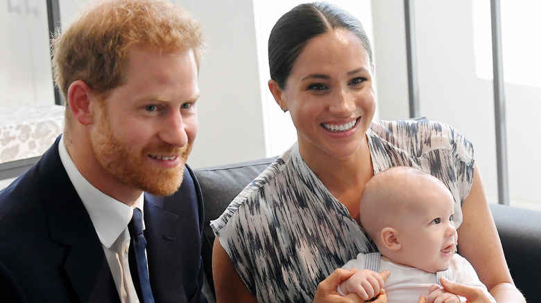 Prince Harry, Meghan Markle, smiling with baby Archie