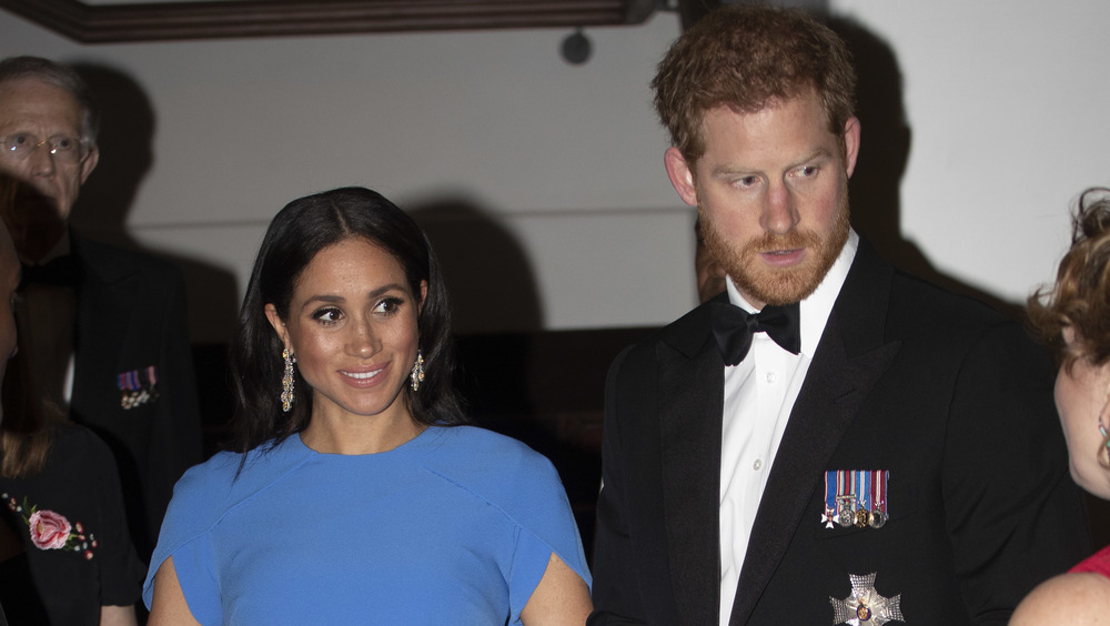 Prince Harry and wife Meghan Markle at a state dinner in Fiji