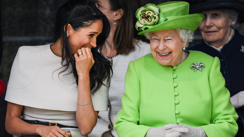 Queen Elizabeth and Meghan Markle sharing a laugh