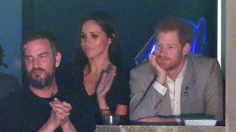 meghan markle, prince harry, and markus anderson attend show together