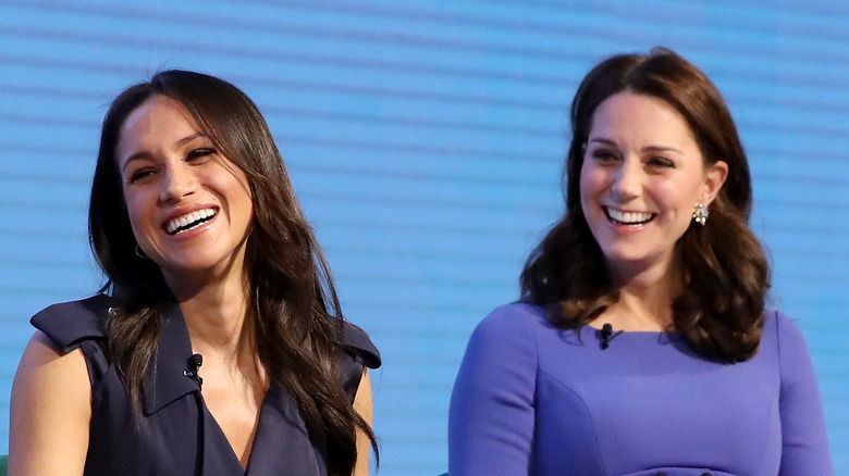 Meghan Markle and Kate Middleton smiling 