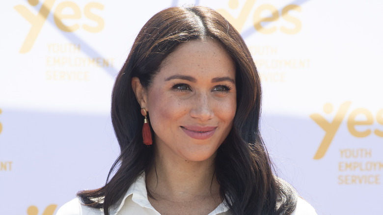 Meghan Markle smiles at an event. 