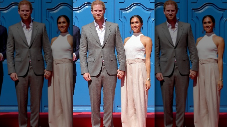 Prince Harry and Meghan Markle posing on the red carpet together