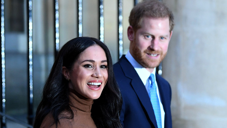 Prince Harry with wife Meghan Markle.