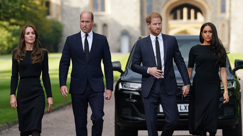 Kate Middleton, Prince William, Prince Harry, and Meghan Markle walking