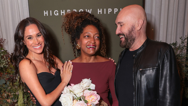 Meghan Markle laughing with Kadi Lee and Serge Normant at Highbrow Hippie launch party