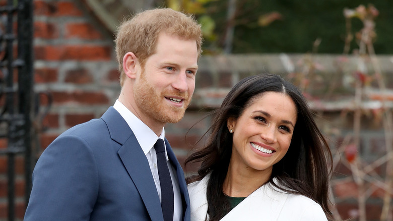 Meghan Markle and Prince Harry pose for a photo