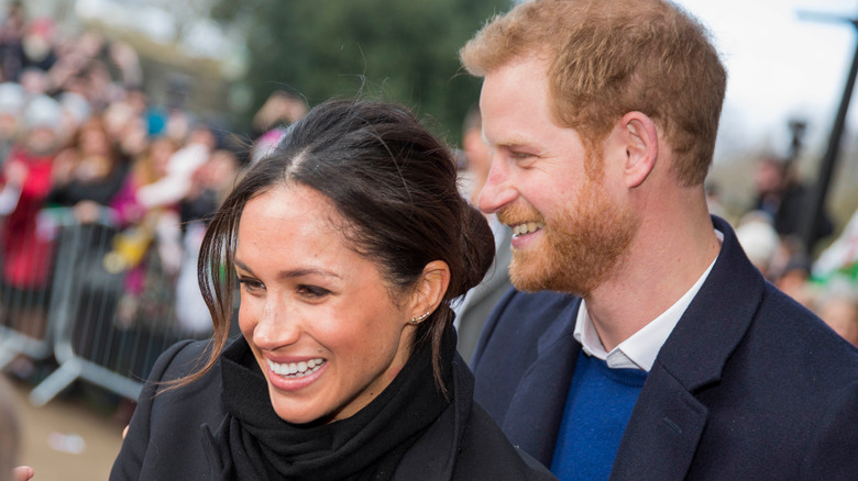 Meghan Markle smiling with Prince Harry