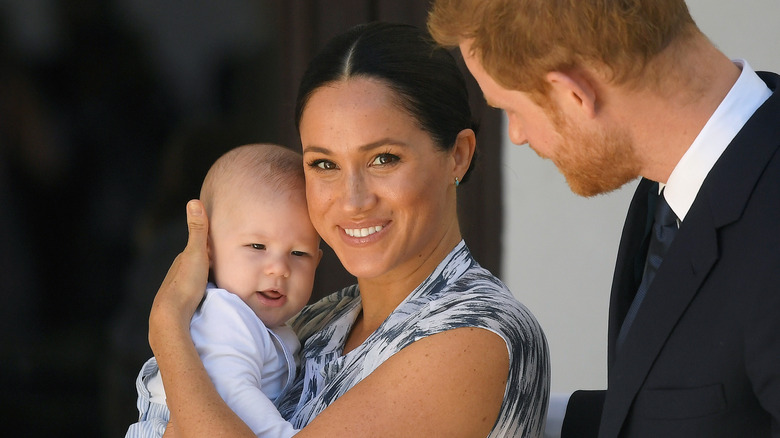 Meghan Markle holding baby Archie with Prince Harry