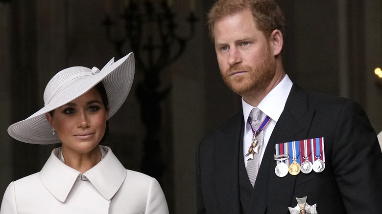 Meghan Markle and Prince Harry looking grumpy at the jubilee