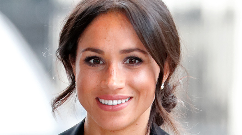 Meghan Markle smiles for photographers 