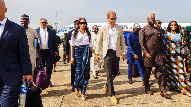 Meghan Markle & Prince Harry walking at Lagos airport