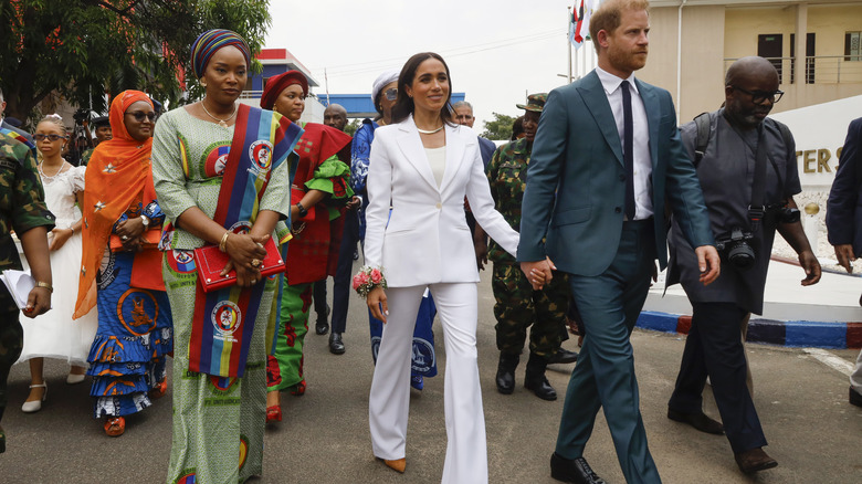 Meghan Markle & Prince Harry walking in Nigeria