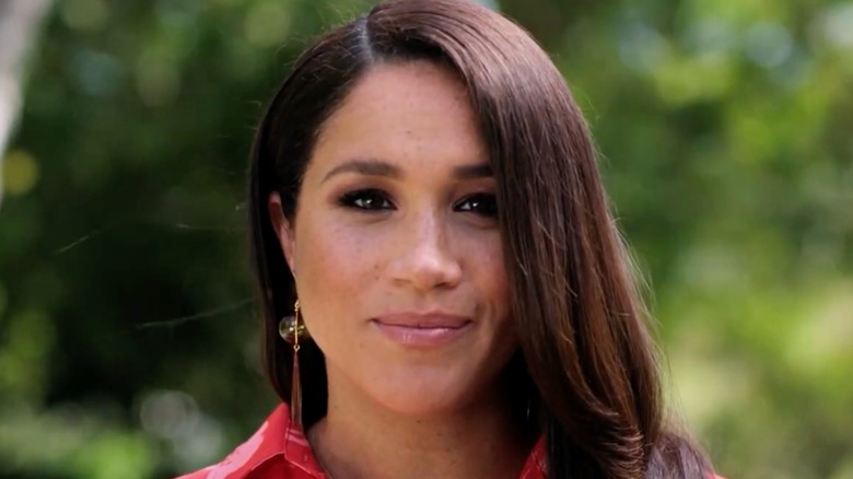 Closeup screenshot of Meghan Markle looking at camera during video