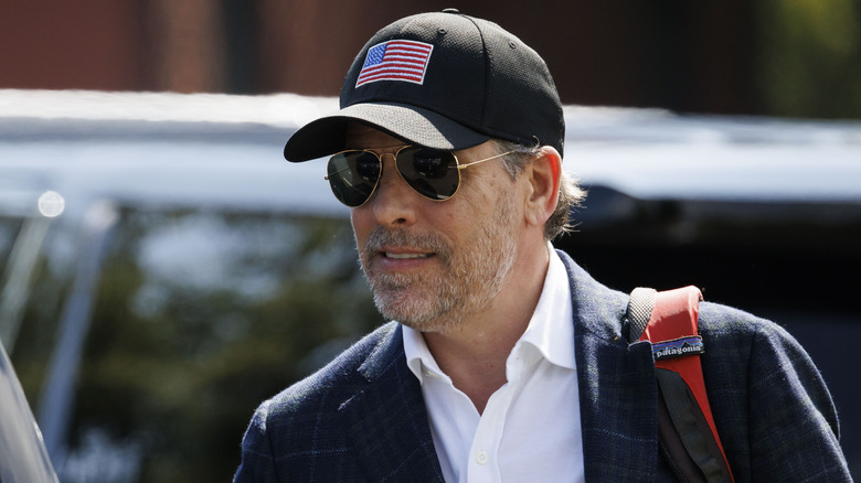 Hunter Biden wearing aviators and a baseball cap