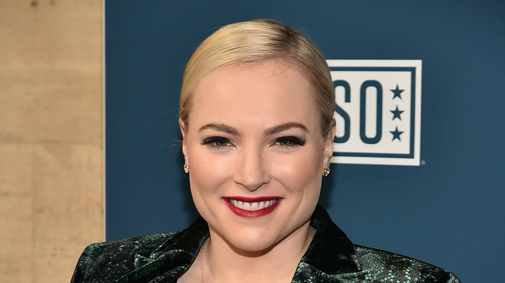 Meghan McCain smiling in green blazer