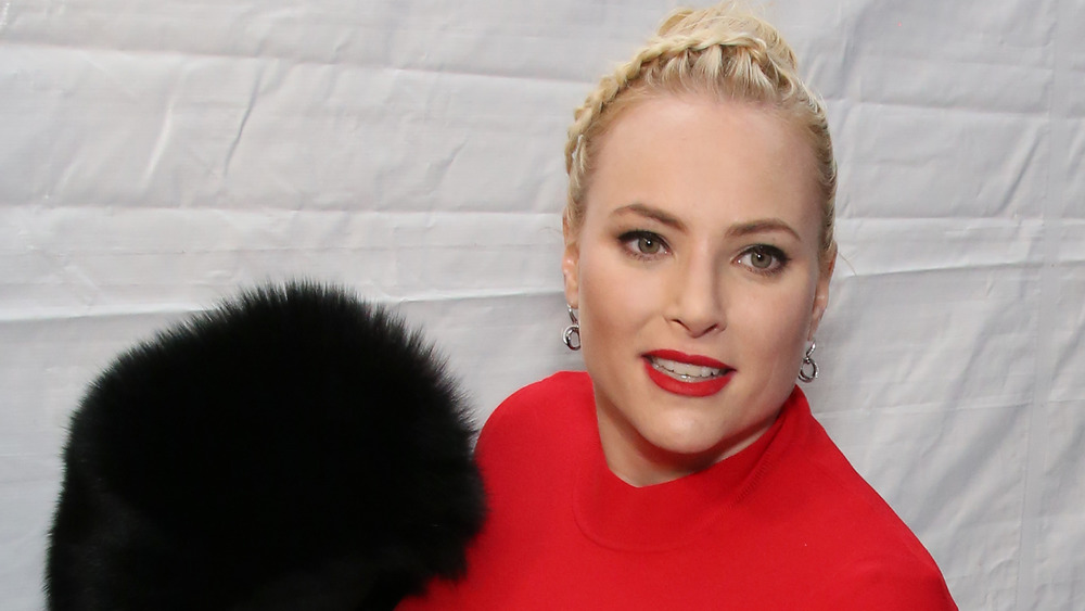 Meghan McCain wearing red