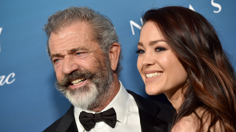 Mel Gibson and Rosalind Ross smiling